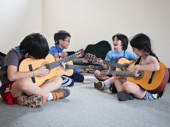 Guitar lessons by Ouch Music Academy Sdn Bhd